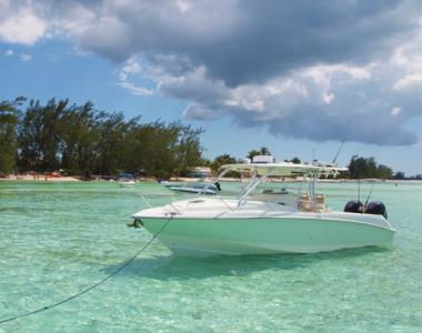 Small boat floating close to shore